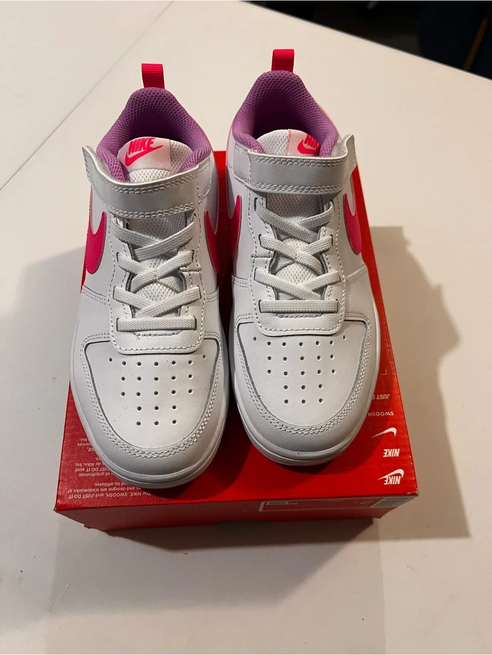 Nike Kids White Sneakers with Pink Accents
